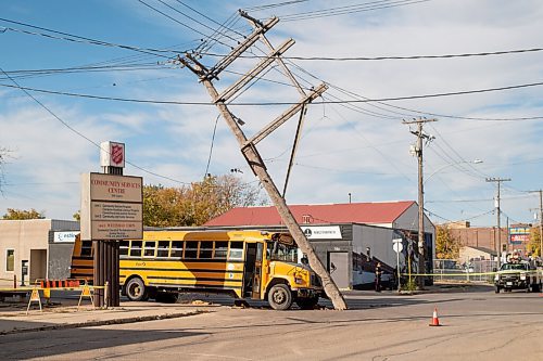 Mike Sudoma / Winnipeg Free Press
The scene of a hydro pole balancing a top a school bus after a collision at the intersection of Logan Ave at Stanley St. The collision happened around 3:30pm Friday afternoon as per authorities on the scene. Both lanes of traffic are blocked off as the hydro poles are quite unstable as a result of the collision
September 25, 2020