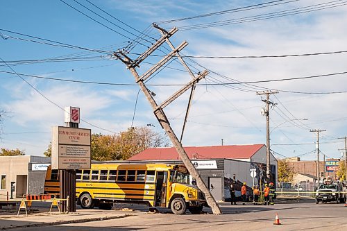 Mike Sudoma / Winnipeg Free Press
The scene of a hydro pole balancing a top a school bus after a collision at the intersection of Logan Ave at Stanley St. The collision happened around 3:30pm Friday afternoon as per authorities on the scene. Both lanes of traffic are blocked off as the hydro poles are quite unstable as a result of the collision
September 25, 2020