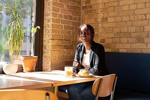 Mike Sudoma / Winnipeg Free Press
Samia Mouhamed enjoys an iced latte and croissant as she sits inside Forth Coffee Friday afternoon
September 25, 2020