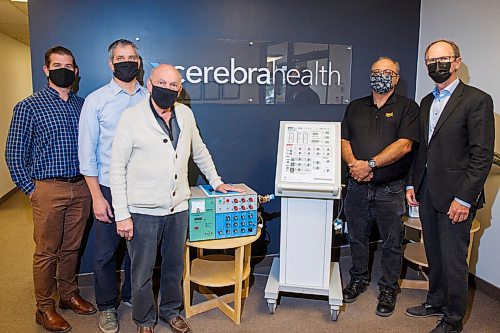 MIKE DEAL / WINNIPEG FREE PRESS
(from left) Patrick Crampton CCO at Cerebra Health, Dawson Riemer, president, Dr. Magdy Younes (the original inventor of the ventilator technology), the original "Winnipeg Ventilator" and the new Winnipeg Ventilator 2.0, Tony Bugeja director of operations at Cerebra Health, and Earl Gardiner chairman of Cerebra Health.
The Winnipeg Ventilator which was fast-tracked into development using a prototype developed in Winnipeg by U of M scientist Magdy Younes about 30 years ago, has just received Health Canada approval and the first 7,500 are now in production at a Toronto facility.
200928 - Monday, September 28, 2020.