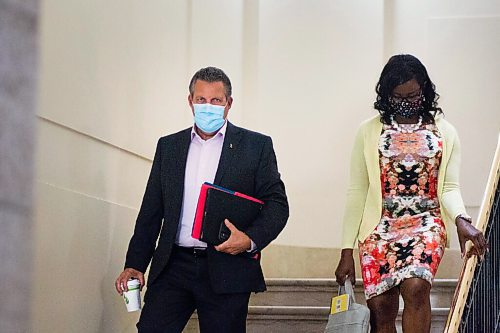 MIKAELA MACKENZIE / WINNIPEG FREE PRESS

Minister of justice Cliff Cullen (left) and PC MLA Audrey Gordon wear masks while walking through the halls at the Manitoba Legislative Building in Winnipeg on Monday, Sept. 28, 2020.

Winnipeg Free Press 2020