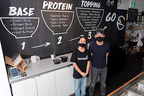 JESSE BOILY  / WINNIPEG FREE PRESS
Andy Zhehong Wen, owner of Poke Mono, and his wife Lily Zhao at their downtown restaurant on Monday. Monday, Sept. 28, 2020.
Reporter:  Alison Gillmor