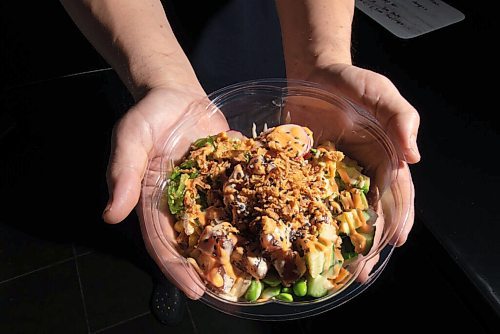 JESSE BOILY  / WINNIPEG FREE PRESS
Andy Zhehong Wen, owner of Poke Mono, shows the popular classic tuna bowl at his downtown restaurant on Monday. Monday, Sept. 28, 2020.
Reporter:  Alison Gillmor