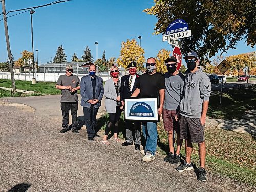 Canstar Community News Sign toppers, like the one pictured marking Honourary Walter Nilsson Way, are part of a campaign led by Peter Martin and Corneilius Thiessen who, along with the assistance of Coun. Shawn Nason (Transcona) are hoping to honour living veterans of the Second World War with a connection to Transcona. Pictured, from left: Thiessen, Nason, Sandra Nilsson, Martin, Arne Nilsson, Jason Nilsson, and Trevor Nilsson. (SHELDON BIRNIE/CANSTAR/THE HERALD)