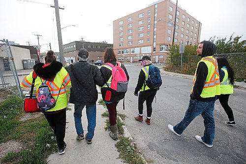 JOHN WOODS / WINNIPEG FREE PRESS
Thunderbirdz, a recently formed community group who conduct walks in different areas of the city to care for homeless and marginalized community members, are photographed downtown Winnipeg assisting and feeding people Monday, September 28, 2020. 

Re: Rutgers
