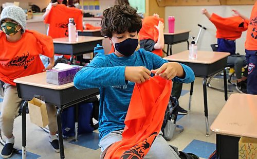 RUTH BONNEVILLE / WINNIPEG FREE PRESS

LOCAL - orange shirt day

Photo of Elliot Thimm (blue) a student at Robert H Smith school, putting on an orange shirt for Orange Shirt Day.  

ORANGE SHIRT DAY: Typically, on Sept. 30 - Orange Shirt Day - the older students at Robert H Smith take a neighbourhood walk to the old Assiniboia Indian Residential High School site on Academy, a 20-minute walk from their public school. Due to social distancing worries the students won't walk to the site this year, but instead will discuss the little-known history of the River Heights residential school throughout the day at their school, starting with a virtual assembly. 


See Maggie's story. 

Sept 29th,, 2020