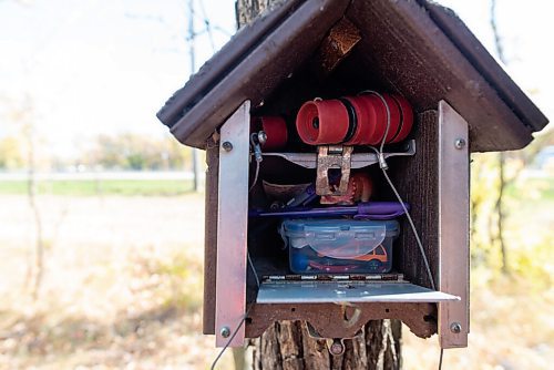 JESSE BOILY  / WINNIPEG FREE PRESS
A peek inside a geocache at Assiniboine Park on Tuesday. Geocaching is like a treasure hunt around the city using GPS locations that hide lists of people who found the cache. Tuesday, Sept. 29, 2020.
Reporter: Brenda Suderman