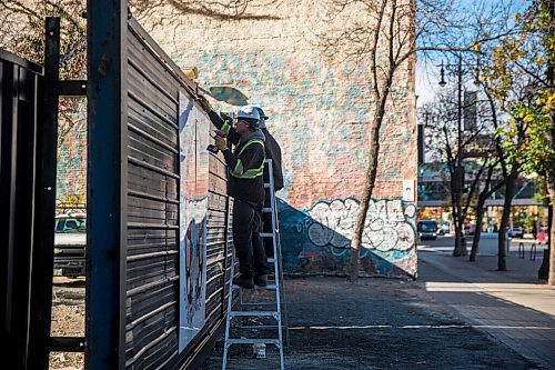 MIKAELA MACKENZIE / WINNIPEG FREE PRESS

Karl Bueckert installs Wind of the Supernatural by Bubzee and Sage Nowak at 396 Portage Avenue as part of the Wall-to-Wall mural festival installation in Winnipeg on Thursday, Oct. 1, 2020. 

Winnipeg Free Press 2020