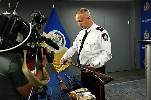 MIKE DEAL / WINNIPEG FREE PRESS
Winnipeg Police Inspector Max Waddell with drugs and guns that were collected during the arrest in June of three men involved in drug trafficking. 
201002 - Friday, October 2, 2020.