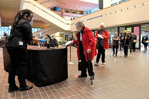 Daniel Crump / Winnipeg Free Press. Valeria Ross self-scans her ticket on opening night of the Winnipeg Symphony ORchestras first concert since COVID shut them down in March. October 2, 2020.