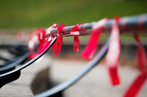 JOHN WOODS / WINNIPEG FREE PRESS
Red ribbons are placed for Murdered and Missing Indigenous Women and Girls (MMIWG) on Red Dress Day at the Forks in Winnipeg Sunday, October 4, 2020. 

Reporter: Katie