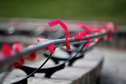 JOHN WOODS / WINNIPEG FREE PRESS
Red ribbons are placed for Murdered and Missing Indigenous Women and Girls (MMIWG) on Red Dress Day at the Forks in Winnipeg Sunday, October 4, 2020. 

Reporter: Katie