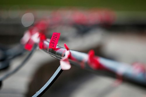 JOHN WOODS / WINNIPEG FREE PRESS
Red ribbons are placed for Murdered and Missing Indigenous Women and Girls (MMIWG) on Red Dress Day at the Forks in Winnipeg Sunday, October 4, 2020. 

Reporter: Katie