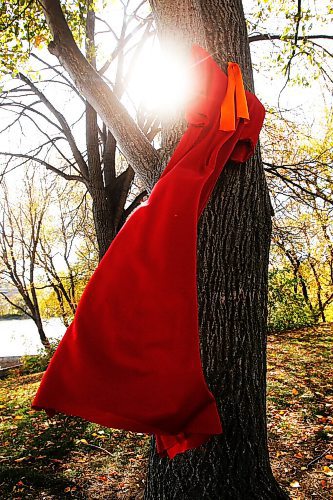 JOHN WOODS / WINNIPEG FREE PRESS
A red dress swings in the wind placed for Murdered and Missing Indigenous Women and Girls (MMIWG) on Red Dress Day at the Forks in Winnipeg Sunday, October 4, 2020. 

Reporter: Katie