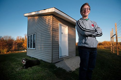 JOHN WOODS / WINNIPEG FREE PRESS
Noah Jonker, 15, is photographed with his dog Bentley outside the 8x12ft. or 96 sq. ft. (8.92 sq. m.) tiny house he built in his back yard in Springfield Wednesday, October 7, 2020. 

Reporter: Kellen