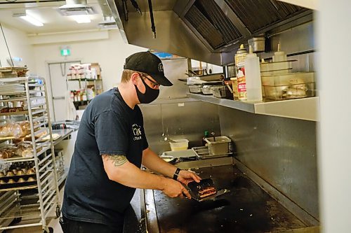 Mike Sudoma / Winnipeg Free Press
Rob deJonge, Manager of LArche Tova, cooks up their signature Blue Collar Special breakfast, complete with turkey sausage, 2 eggs, and hash browns Wednesday morning
October 7, 2020