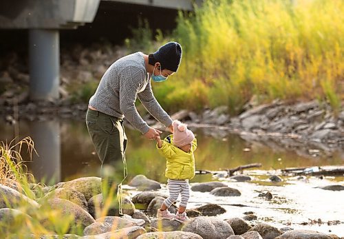 Mike Sudoma / Winnipeg Free Press
Tomo Maya and his daughter Hinako share a moment as Hinako practices walking along the creek in Royal Wood Friday evening
October 9, 2020