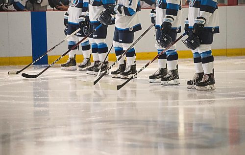 Mike Sudoma / Winnipeg Free Press
The Steinbach Pistons starting line up stand as Oh Canada is played over the speakers at the WJHL Season opener Friday night at RINK Training Centre
October 9, 2020