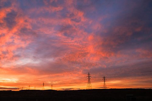 Mike Sudoma / Winnipeg Free Press
The sun sets behind a row of hydro electric lines Friday evening along Mcgillivary Blvd
October 9, 2020