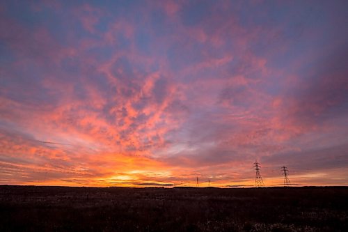 Mike Sudoma / Winnipeg Free Press
The sun sets behind a row of hydro electric lines Friday evening along Mcgillivary Blvd
October 9, 2020