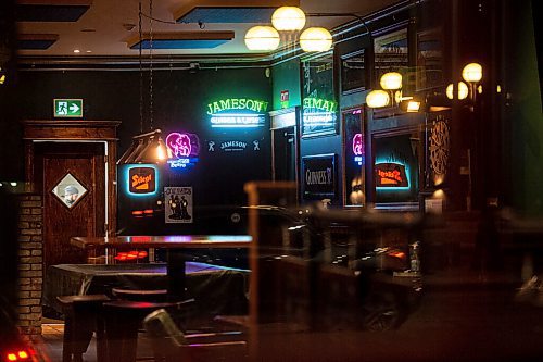 Mike Sudoma / Winnipeg Free Press
Its 11pm. Nothing but neon signs, empty tables and staff finishing up their shifts inside of the Toad in the Hole Pub
October 9, 2020