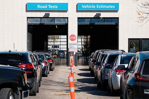 Daniel Crump / Winnipeg Free Press. Vehicles snake around the parking lot at the drive-in COVID test site on Main Street in the North End. October 10, 2020.