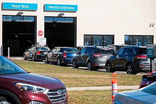 Daniel Crump / Winnipeg Free Press. Vehicles snake around the parking lot at the drive-in COVID test site on Main Street in the North End. October 10, 2020.