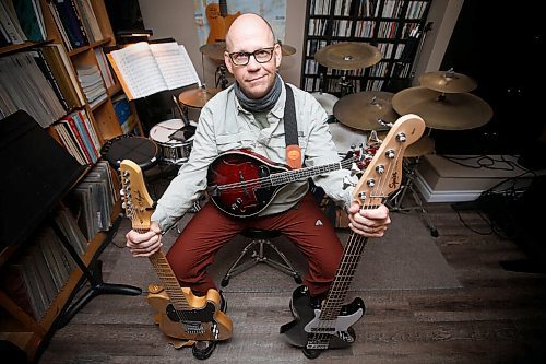 JOHN WOODS / WINNIPEG FREE PRESS
Robert Burton, owner of River Heights School of Music, is photographed with a few of his new musical toys in his studio Monday, October 12, 2020. Guitar lessons and purchases have increased during the COVID-19 pandemic.

Reporter: Small