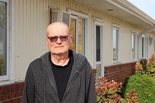 Canstar Community News Jim Moffat stands outside his residence in Sanford on Sept. 29. Moffat and his wife Bev are considering moving to Winnipeg to have ensured hospital admittance, but they'd prefer to stay where they are. (GABRIELLE PICHÉ/CANSTAR COMMUNITY NEWS/HEADLINER)