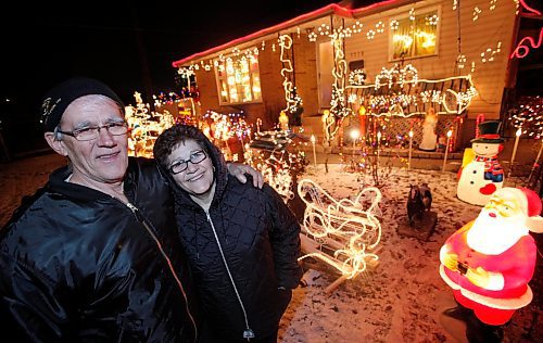 BORIS.MINKEVICH@FREEPRESS.MB.CA BORIS MINKEVICH/ WINNIPEG FREE PRESS  091210 Christmas lights on Redwood (1200 block).  Carlos and Fatema Sousa have been taking great efforts to light up their neighborhood since 1975. They have 6 grandchildren that love the display. They host xmas dinner for the family. They said that they brought the tradition over from Portugal where they immigrated from in the early 70's. They also have a massive xmas display set up inside the house. For further information please call 582-5961.