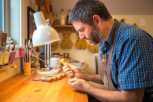 MIKAELA MACKENZIE / WINNIPEG FREE PRESS

Garth Lee works on carving a scroll in his studio, where he builds violins, violas, and cellos from scratch, in Winnipeg on Friday, Oct. 16, 2020. For Holly Harris story.

Winnipeg Free Press 2020