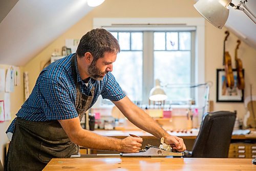 MIKAELA MACKENZIE / WINNIPEG FREE PRESS

Garth Lee planes a brace in his studio, where he builds violins, violas, and cellos from scratch, in Winnipeg on Friday, Oct. 16, 2020. For Holly Harris story.

Winnipeg Free Press 2020