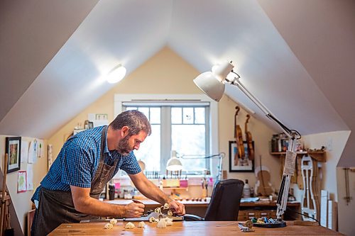 MIKAELA MACKENZIE / WINNIPEG FREE PRESS

Garth Lee planes a brace in his studio, where he builds violins, violas, and cellos from scratch, in Winnipeg on Friday, Oct. 16, 2020. For Holly Harris story.

Winnipeg Free Press 2020