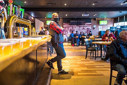 MIKAELA MACKENZIE / WINNIPEG FREE PRESS

Ravi Ramberran, owner of the Four Crowns, poses for a portrait in the bar and restaurant in Winnipeg on Friday, Oct. 16, 2020. Bars, beverage rooms, nightclubs, and bingo halls have been ordered to close for two weeks starting Monday. For Malak Abas story.

Winnipeg Free Press 2020