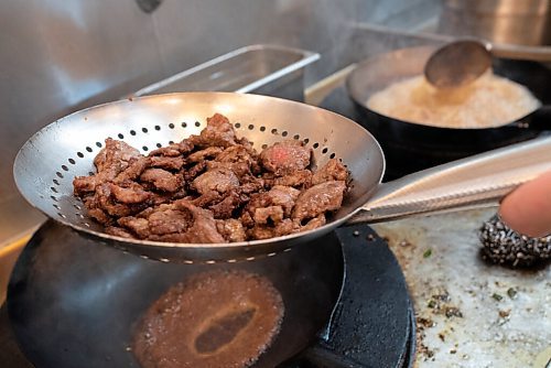 JESSE BOILY  / WINNIPEG FREE PRESS
Joey Perrins cooks up some Mongolian beef at P.F. Chang's on Friday. Friday, Oct. 16, 2020.
Reporter: