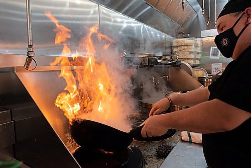 JESSE BOILY  / WINNIPEG FREE PRESS
Joey Perrins cooks up some Mongolian beef at P.F. Chang's on Friday. Friday, Oct. 16, 2020.
Reporter: