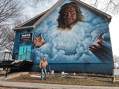 Canstar Community News Charlie Johnston, an international award winning mural artist, has painted a new mural on the wall of the Tabor Baptist Church (710 Madeline St.) after his award winning mural was painted over at the location last summer. (SHELDON BIRNIE/CANSTAR/THE HERALD)