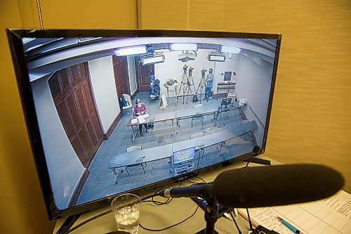 MIKE DEAL / WINNIPEG FREE PRESS
A monitor in a separate room for the media moderator shows an empty seating area that is usually filled with six reporters. Dr. Roussin's assistant sits at a table while the pool videographer stands beside his camera.
Dr. Brent Roussin, chief provincial public health officer during the latest COVID-19 update at the Manitoba Legislative building Monday, October 19, 2020.
201019 - Monday, October 19, 2020.