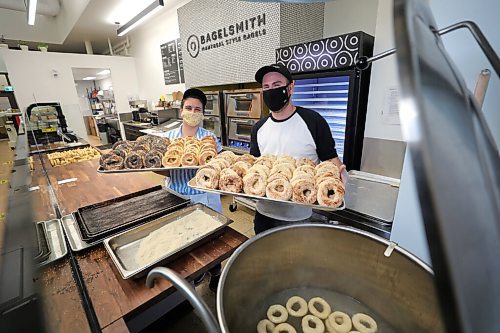 RUTH BONNEVILLE / WINNIPEG FREE PRESS

BIZ - Bagelsmith

Photo of Bagelsmith owner, Phil Klein, with his traditional Montreal bagels in his shop on Carlton.  Manager Jenn Kostesky is an integral part of the operation. 

Since May, Phil Kleins Bagelsmith restaurant has sold over 100,000 bagels. One hundred thousand bagels. And they didnt even open their physical shop until this week! Through online sales, the start-up bagel shop on Carlton Street has struck gold. They also have distribution at Piazza de Nardi and at Myers Delicatessen.


Reporter: Ben Waldman

Oct 20th, 2020