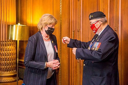 MIKAELA MACKENZIE / WINNIPEG FREE PRESS

Lt.-Gov. Janice Filmon receives the first poppy of the poppy campaign from comrade Ronn Anderson, chairman of the poppy campaign, at the Manitoba Legislative Building in Winnipeg on Wednesday, Oct. 21, 2020. Standup.

Winnipeg Free Press 2020