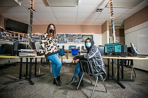 MIKAELA MACKENZIE / WINNIPEG FREE PRESS

Yearbook teacher Heather Bell (left) and student Ayesha Qadir pose for a portrait at Fort Richmond Collegiate in Winnipeg on Thursday, Oct. 22, 2020. Putting yearbooks together in a pandemic is proving to be a challenge. For Maggie Macintosh story.

Winnipeg Free Press 2020