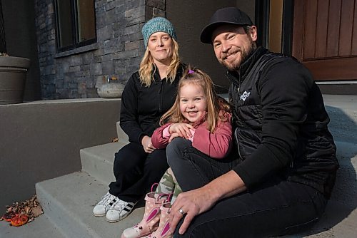 JESSE BOILY  / WINNIPEG FREE PRESS
The curling couple Mike and Dawn McEwen sit outside their home with their daughter Vienna on Thursday. The duo have not been able to curl during the pandemic. Thursday, Oct. 22, 2020.
Reporter: Jason Bell