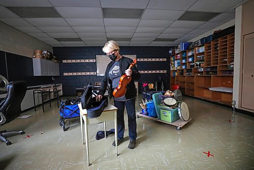 RUTH BONNEVILLE / WINNIPEG FREE PRESS

Forest Park School Principal, Chris Wigglesworth, helps put away musical instruments and supplies from the schools music room being converted into a classroom.   

See Maggie Macintosh's story,
Education Reporter - Winnipeg Free Press

Oct 23rd, 2020