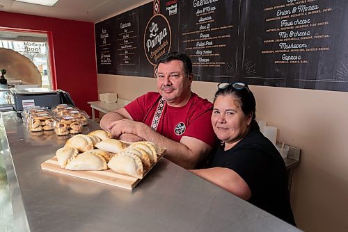 JESSE BOILY  / WINNIPEG FREE PRESS
Alfonso and Roxana Maury, owners, stop for a photo with their empanadas at La Pampa Empanadas on Grant Ave on Sunday. The restaurant has 24 different variations of empanadas. Sunday, Oct. 25, 2020.
Reporter: Alison Gillmor