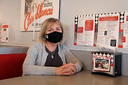 Canstar Community News Bertha Ganas, co-owner of Nick's Inn in Headingley, sits at a booth inside the restaurant on Oct. 21. Employees pasted a menu to the wall near every booth so customers can order without touching one. (GABRIELLE PICHE/CANSTAR COMMUNITY NEWS/HEADLINER)