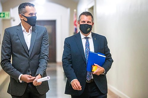 MIKAELA MACKENZIE / WINNIPEG FREE PRESS

Justice minister Cliff Cullen (right) and Dr. Jazz Atwal walk in to speak at a press conference at the Manitoba Legislative Building in Winnipeg on Monday, Oct. 26, 2020. For Carol Sanders story.

Winnipeg Free Press 2020