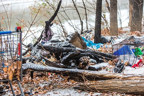 MIKAELA MACKENZIE / WINNIPEG FREE PRESS

The site of a fire at a homeless encampment along the river near the Granite Curling Club in Winnipeg on Tuesday, Oct. 27, 2020. For --- story.

Winnipeg Free Press 2020