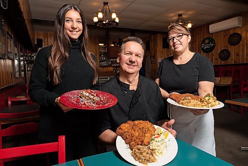 JESSE BOILY  / WINNIPEG FREE PRESS
Paul and Pamela Vocadlo with their daughter Carley stop for a photo in their restaurant Bistro Dansk on Tuesday. Tuesday, Oct. 27, 2020.
Reporter: Eva Wasney