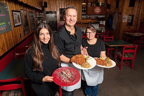 JESSE BOILY  / WINNIPEG FREE PRESS
Paul and Pamela Vocadlo with their daughter Carley stop for a photo in their restaurant Bistro Dansk on Tuesday. Tuesday, Oct. 27, 2020.
Reporter: Eva Wasney