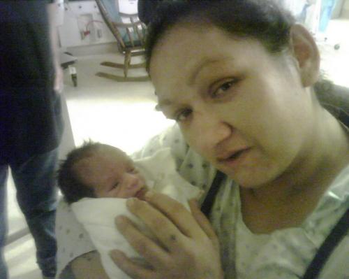 New mom Heather Richard, and son Isaiah after his surprise birth on Sunday. for Winnipeg Free Press